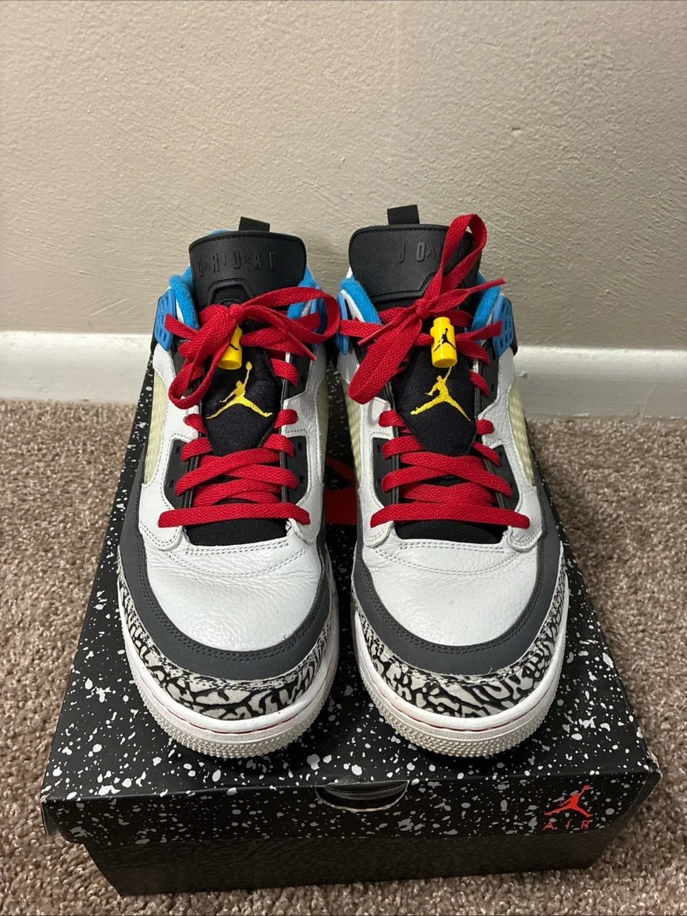 Jordan Men's White Athletic Shoes with Black, Red & Blue Accents